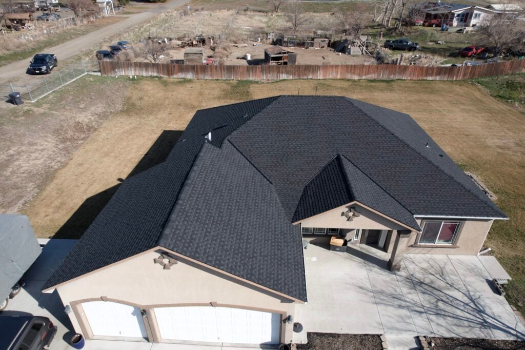 two car garage on tan home with shingle roof in benton city washington