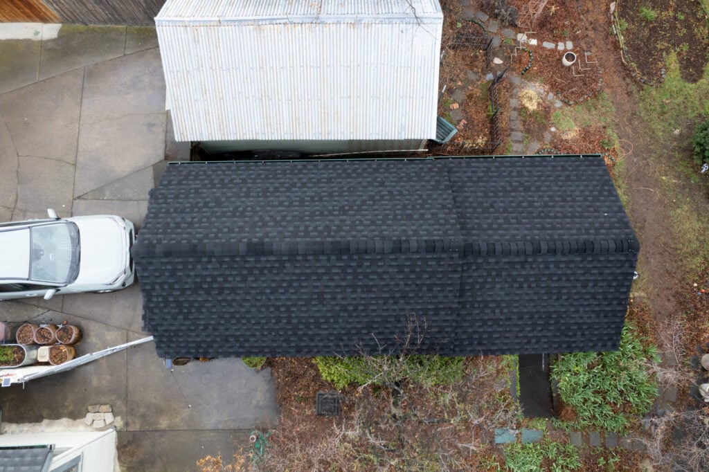 black shingles on garage with car parked in front in washington