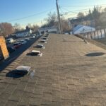 Closeup shot of a brown-shingle roof.