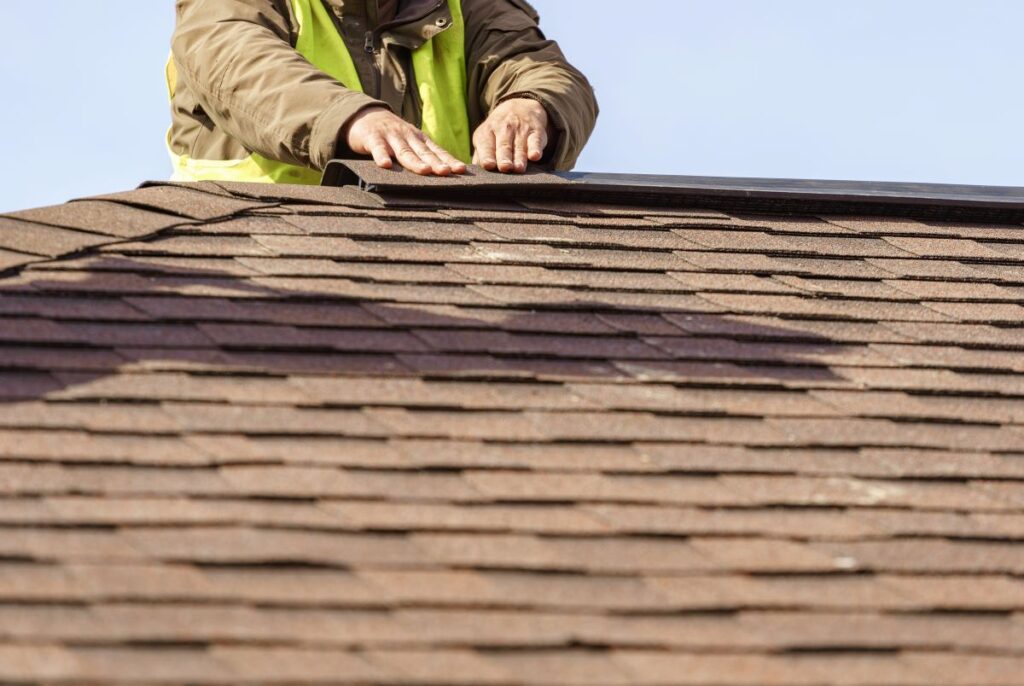 man installing roof