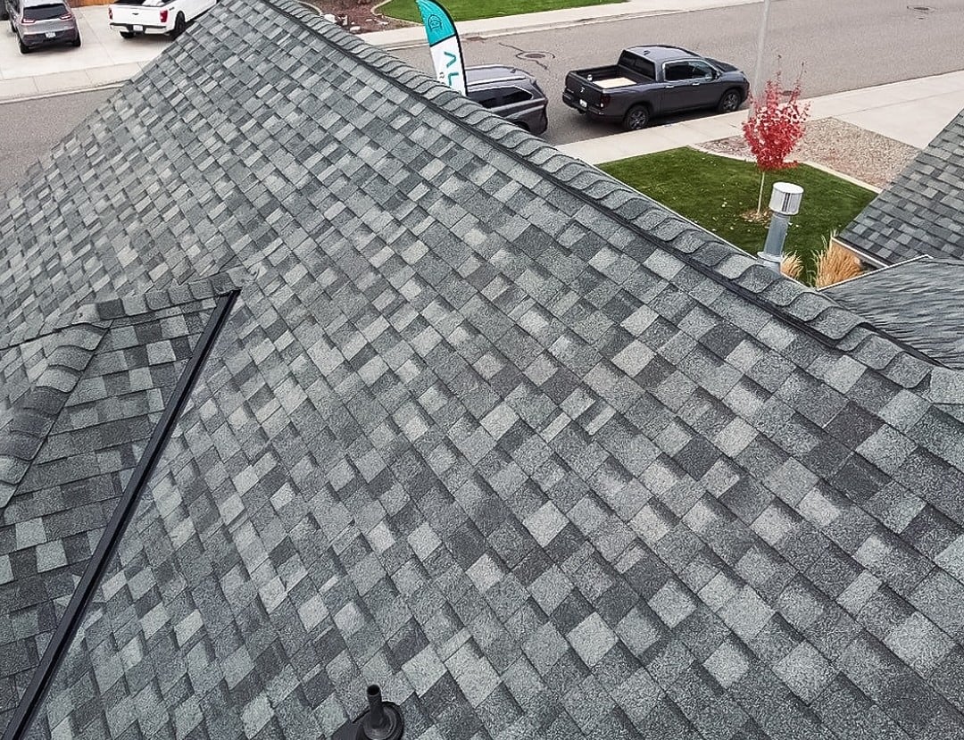 Close up of dark grey architectural asphalt shingles