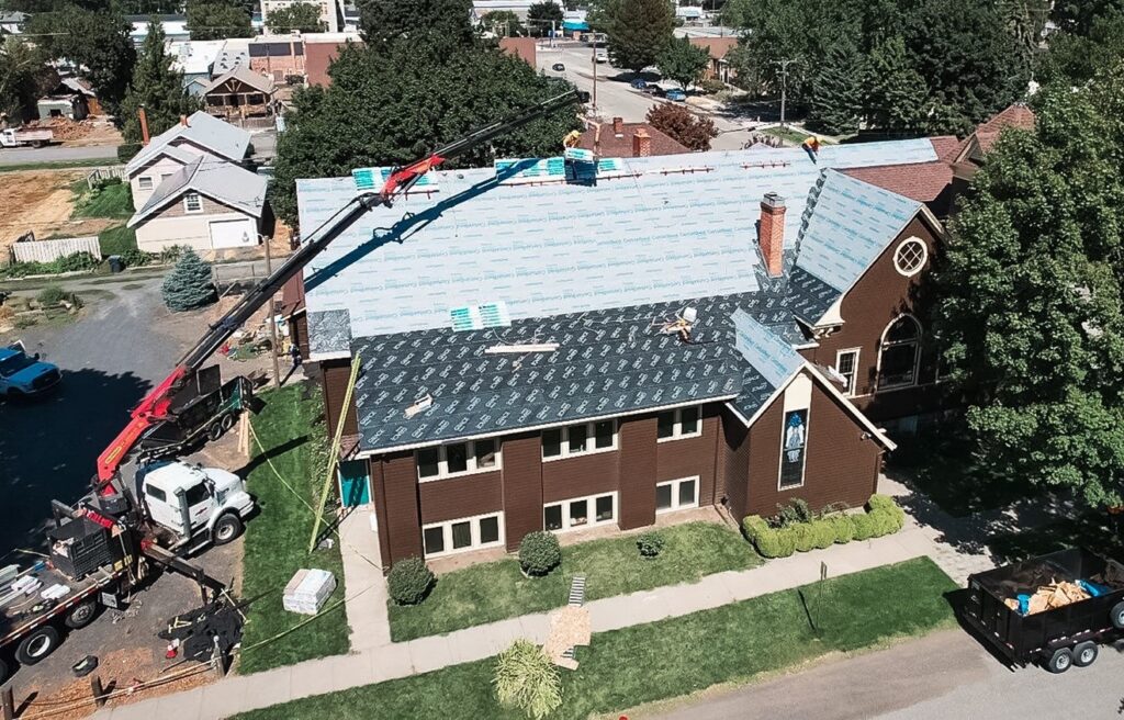 The Alpine Roofing team replacing a roof