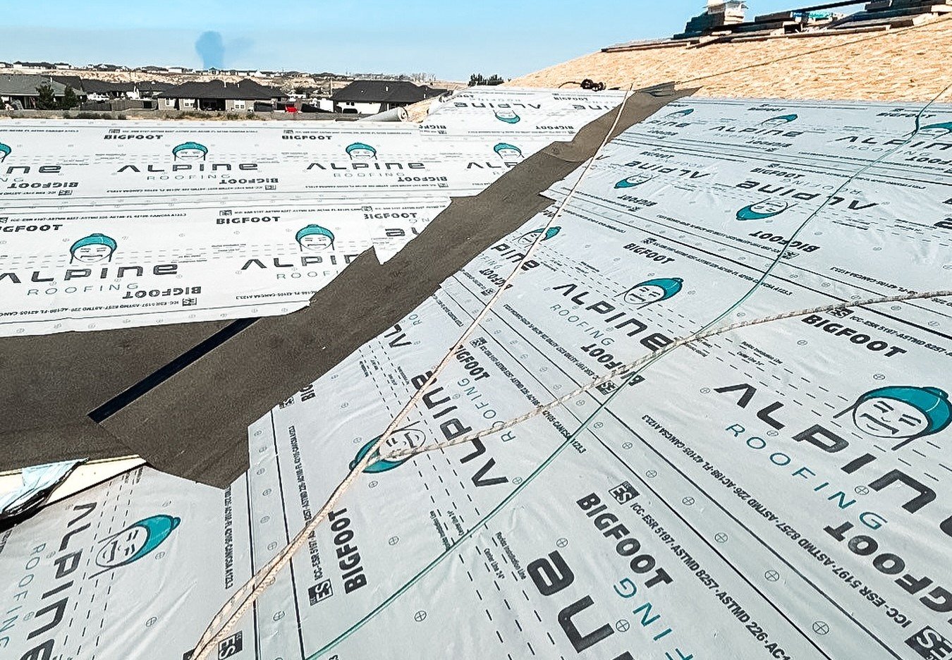 Roof being replacemed by Alpine Roofing