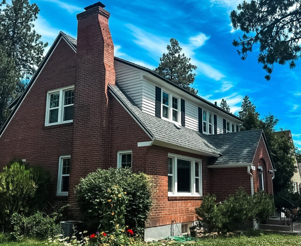 Brick house with asphalt shingle roof