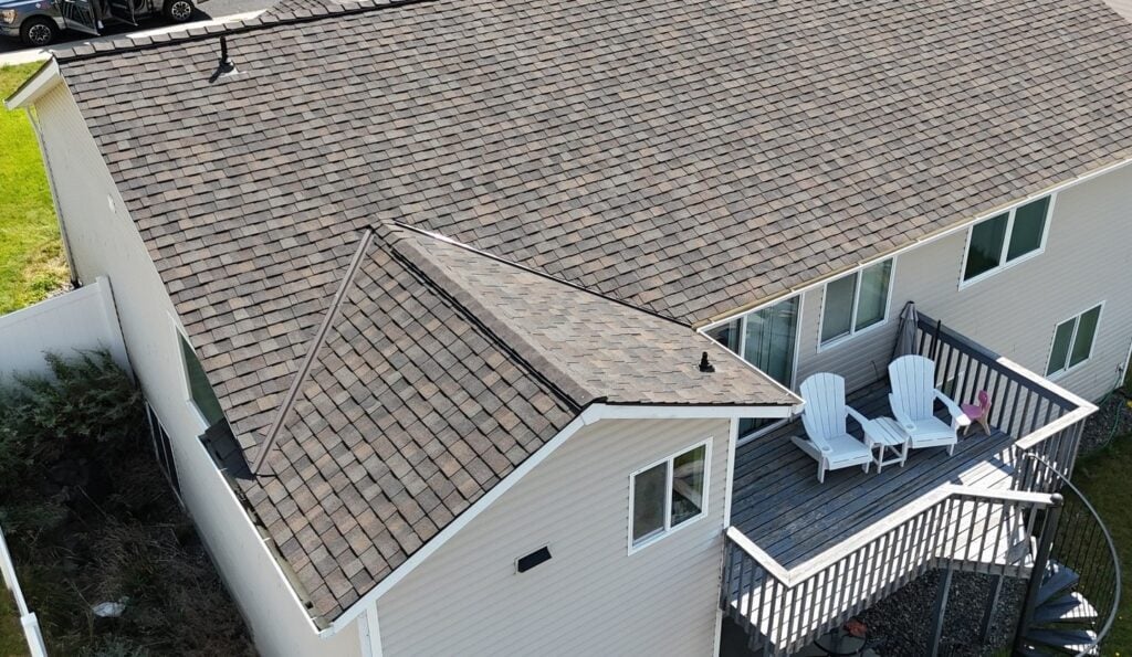 Beige house with tan asphalt shingle roof