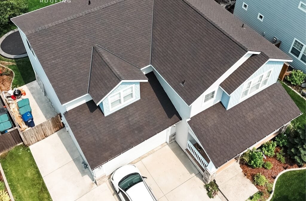 Aerial view of a house with newly installed roof