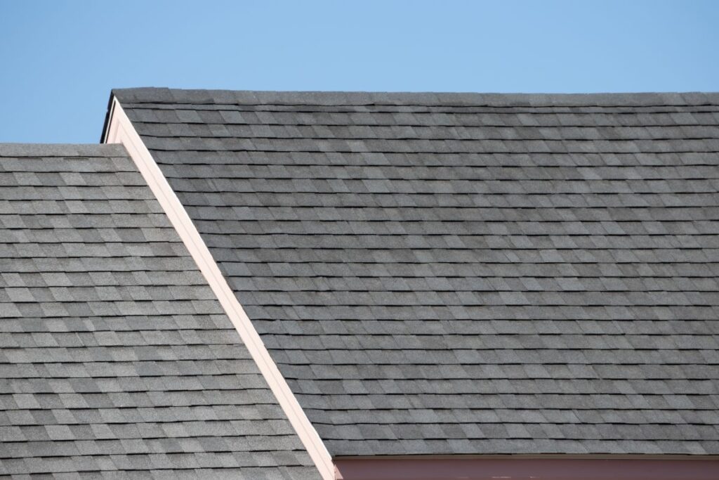 Roof shingles on top of the house against blue sky