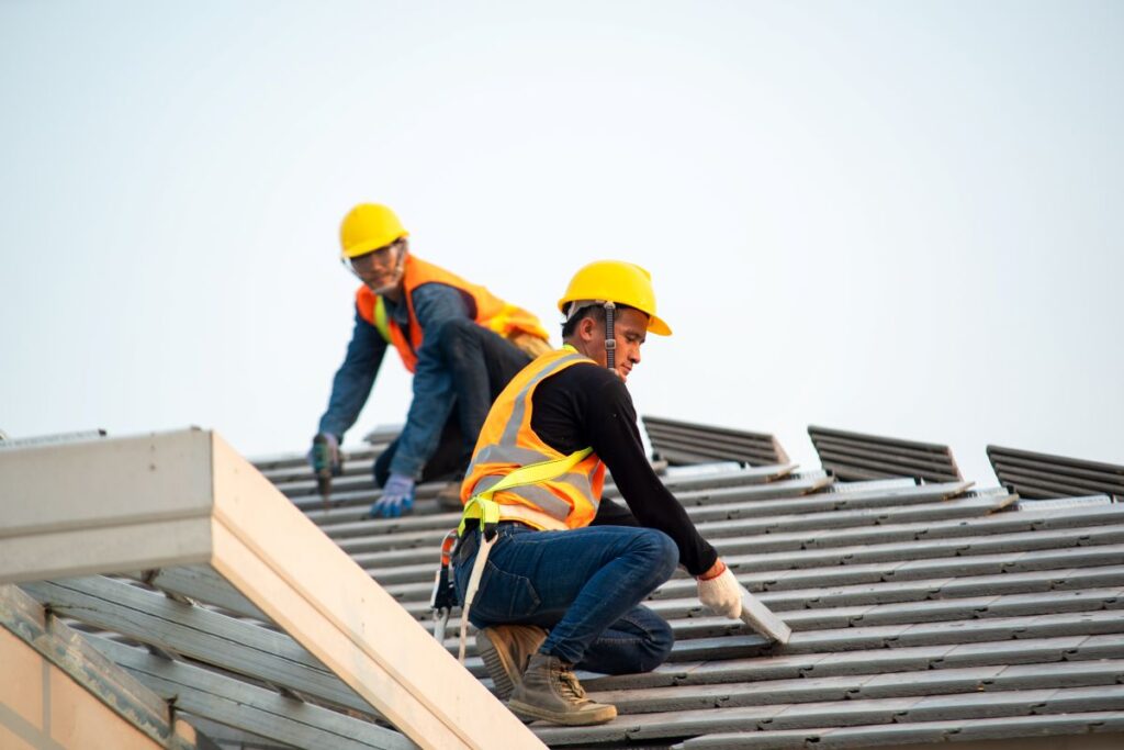 can i get a new roof in winter workers installing new tiles