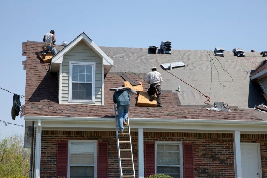 roofing companies in Airway Heights WA workers replacing shingles