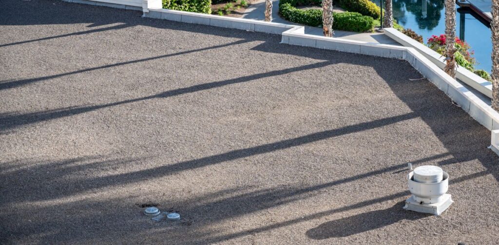 residential flat roof small rocks asphalt
