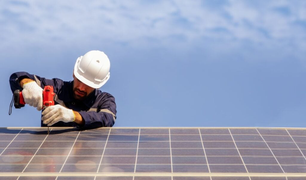 are solar panels worth it spokane roof worker installing solar panel