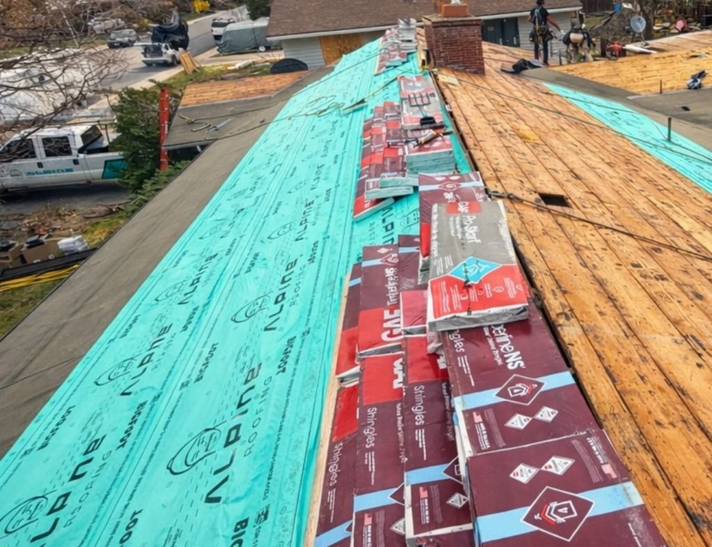 Roof replacement by Alpine Roofing in progress